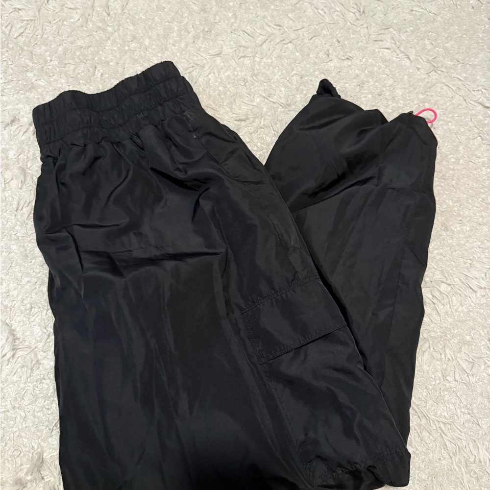 Black athletic pants with Pink Accents